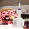 Westmark 40232260 2-in-1 Plum Pitter Stoner with Stainless Steel Plunger and Waste Container, White view 3