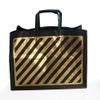 Plastic Shopping Bags, 250pcs"VOGUE" Size: 16x6x12x6, 3 Mil, Flexi-Loop Handle Black Bags with Gold Stripes, 57.9 Cents Per Bag, 144.99 per case. view 1