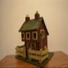 Large Wood Standing Birdhouse Decoration Resembling a Red Barn with a Fence Around the Green Checkered Yard and Pink Roses on the Green Checkered Roof; There Are Three (3) Access Holes for Birds and Large Nesting Area Inside of the Barn. Measurements view 2