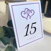 Linked Hearts and Border Wedding Table Numbers (Select Color/Quantity), White, Purple, 1-70, Double Sided, Tent or Use in a Stand, Great for Parties & Restaurants view 1