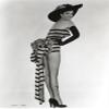 Jane Russell in a striped one piece and wide brimmed hat Photo Print (24 x 30) view 1