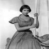 Leslie Caron posed with a Pole in Long Dress Photo Print (8 x 10) view 1