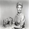 Doris Day Posed in Classic with Sewing Machine Photo Print (30 x 24) view 1