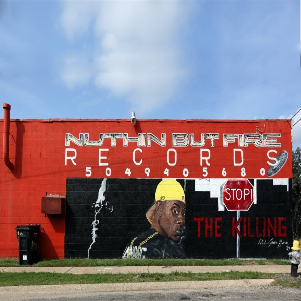 Painted wall sign of a records store with stop sign and rapper images Poster Print (18 x 24)