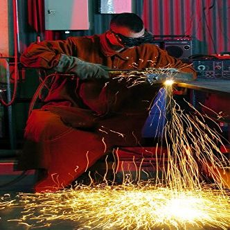 Senior Airman uses an acetylene torch to cut metal Poster Print by Stocktrek Images (22 x 34)