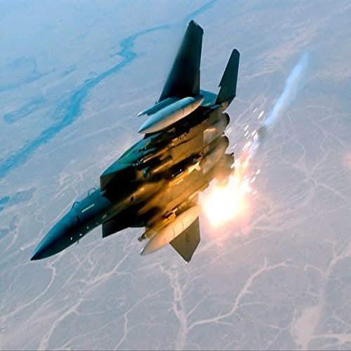 An F-15E Strike Eagle pops flares during a combat sortie Poster Print by Stocktrek Images (17 x 11)