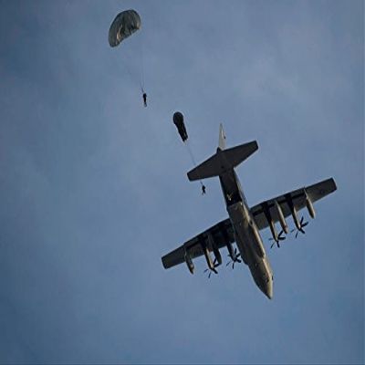 Personnel jump from a C-130 Hercules during a static-line jump Poster Print by Stocktrek Images (17 x 11)