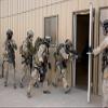 Pararescuemen enter a building to retrive wounded hostages Poster Print by Stocktrek Images (17 x 11) view 1