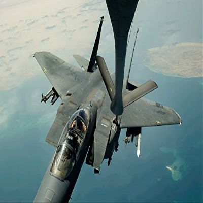 An F-15E Strike Eagle receives fuel from a KC-135R Stratotanker Poster Print by Stocktrek Images (17 x 11)