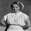 Bette Davis Posed with Hands on the Back in White Short Sleeve Knitted Cotton Dress and White Belt Photo Print (24 x 30) view 1