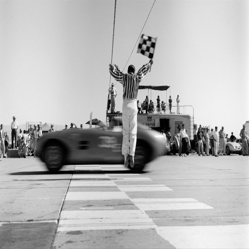 1960s Man Jumping Waving Checkered Flag For Winning Sports Car Crossing The Finish Line Print By Vintage Collection