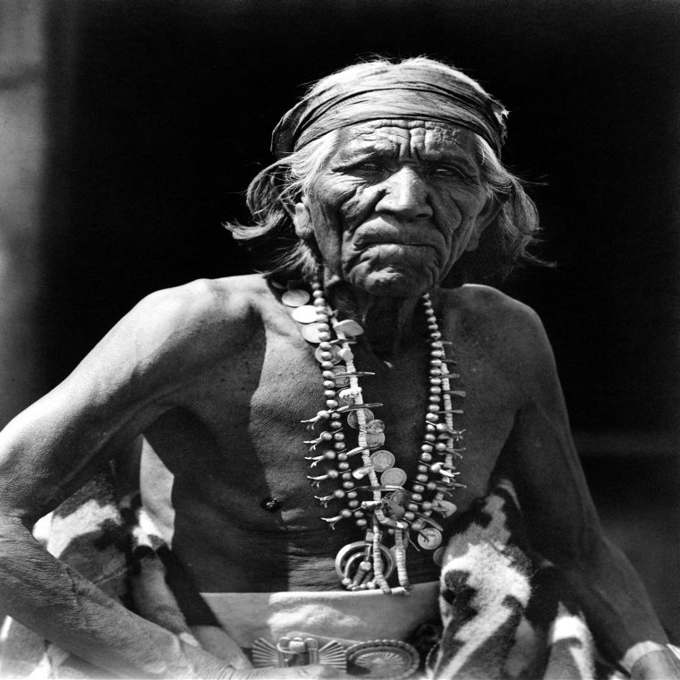 Navajo Man C1913 Nmany Goats A Navajo Man Wearing A Headband And A Silver Squash Blossom Necklace Photograph By Roland Reed C1913 Poster Print by (24 x 36)