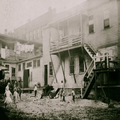 Cottage Street hovels down by the river in Easthampton Mass in which a great deal of home work is done on suspenders Poster Print (18 x 24)