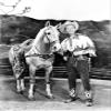 Roy Rogers in a cowboy costume with a horse Photo Print (8 x 10) view 1