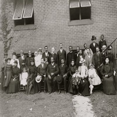 Members of the First Congregational Church Atlanta Georgia posed outside the brick church 30 people including men women and children The Reverend Henry Hugh Proctor is standing seventh from left Poste
