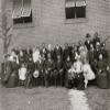 Members of the First Congregational Church Atlanta Georgia posed outside the brick church 30 people including men women and children The Reverend Henry Hugh Proctor is standing seventh from left Poste view 1