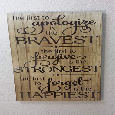 11x20 The First to Apologize is The Bravest The First to Forgive is The Strongest The Fist to Forget is The Happiest in Vinyl Lettering On Stained Wood Inspirational Sayings and Quotes