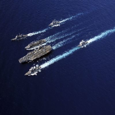 Posterazzi The Abraham Lincoln Carrier Strike Group ships cruise in formation in the Pacific Ocean Poster Print, (34 x 22)
