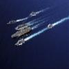 Posterazzi The Abraham Lincoln Carrier Strike Group ships cruise in formation in the Pacific Ocean Poster Print, (34 x 22) view 1
