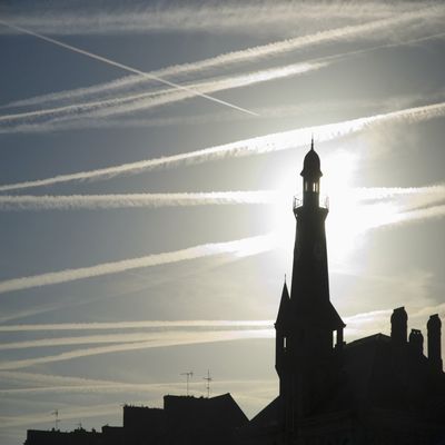 Posterazzi Airplane Contrails Above Lighthouse Poster Print, (34 x 22)