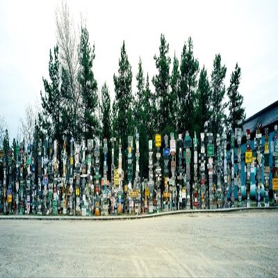 Signposts at the roadside Sign Post Forest Watson Lake Yukon California USA Poster Print (12 x 36)