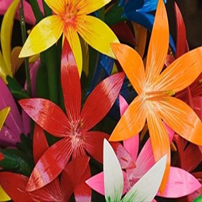 Star shaped carved wooden flowers at market Bo Sang Chiang Mai Thailand Poster Print by Adam Jones (22 x 15)