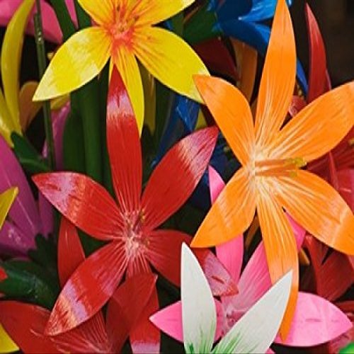 Star shaped carved wooden flowers at market Bo Sang Chiang Mai Thailand Poster Print by Adam Jones (22 x 15)