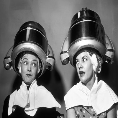 Posterazzi 1950s Two Women Sitting Together Gossiping Under Hairdresser Hair Dryer Poster Print by Vintage Collection, (18 X 24)