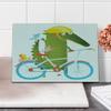 Ambesonne Funny Cutting Board, Green Crocodile Yellow Hat Going for a Bike Ride with Friends Cartoon, Decorative Tempered Glass Cutting and Serving Board, Small Size, Green Aqua view 1