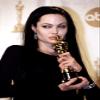 Posterazzi Poster Print Collection Angelina Jolie Kissing Her Academy Award for Girl Interrupted March 2000 Celebrity (8 x 10) view 1