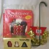 Holiday Style 4 Piece Christmas Assortment Giant Gift Bag, Wreath Hanger, Santa Soaps and Garland view 1