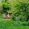 Posterazzi PDDUS39JEG0151 USA, Pennsylvania. A Pair of Adirondack Chairs in a Garden Photo Print, 24 x 18, Multi view 1