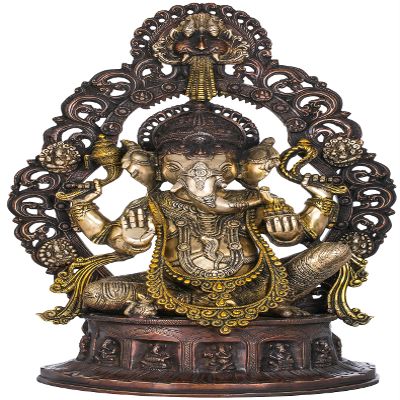 Exotic India Ganesha Seated on Musicial Ganesha Base with Impressive Kirtimukha Aureole - Brass Statue - Color Antique Gold Color