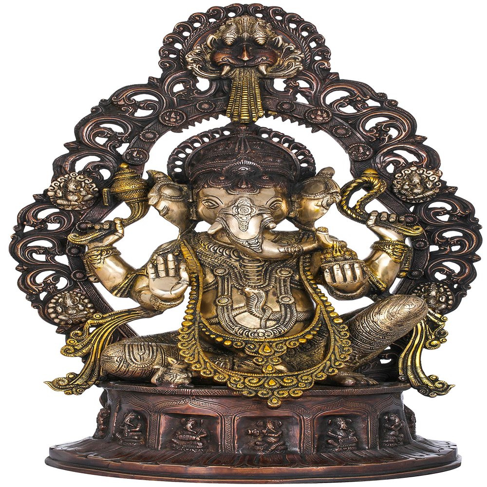 Exotic India Ganesha Seated on Musicial Ganesha Base with Impressive Kirtimukha Aureole - Brass Statue - Color Antique Gold Color