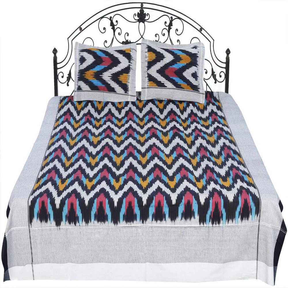 Exotic India Ikat Handloom Bedspread from Pochampally with Zigzag Weave in Multicolor Thread - Pure Cotton with P - Color Moon Struck Color