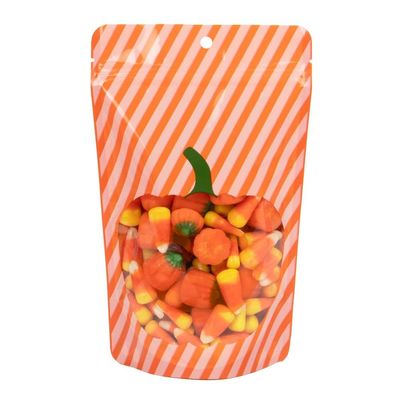 ClearBags Pumpkin Seasonal Stand-Up Zipper Pouch | 5.13 x 3.13 x 8.13 | Halloween Treat Bags with Pumpkin Window & Resealable Closure | Two-Tone Stripes, Solid Orange Back (25 Pack, ZBGW3P)