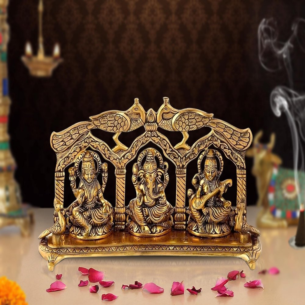 AONA Ganesha Lakshmi and Saraswati Idol Sculpture Seated On Peacock Throne Golden Height 5.5 Inches Width 11.0 Inches