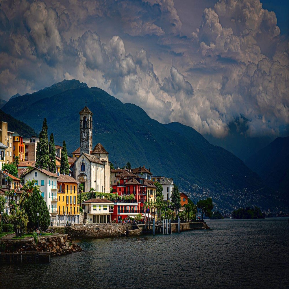 Iconic Arts Laminated 24x36 Poster: Church Under Cloudy Sky alps brissago Building Along with Lake and Landscape of Green Covered Mountain Switzerland hd Travel HD