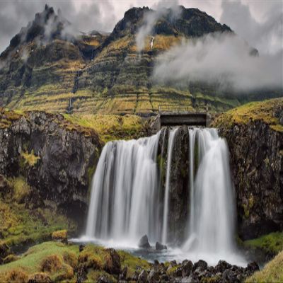 Iconic Arts Laminated 24x36 Poster: Snowfall on Rocks Pouring on River in Mountains with Fog Background Nature