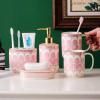 Bathroom Accessories Set, 6 Piece Ceramic Bath Accessory Completes with Soap Lotion Dispenser Pump Toothbrush Holder Tumbler Soap Dish, Tray Great for Modern Bath Sink Tub Decor (Pink Gold Stripes) view 1