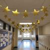 Outus 96 Pieces 11 Inch Large Gold Stars Cutouts Gold Stars Decoration Double Printed Paper Star for Movie Night Bulletin Board Decoration, Classroom Wall Party Decor Graduation Party Decorations view 3