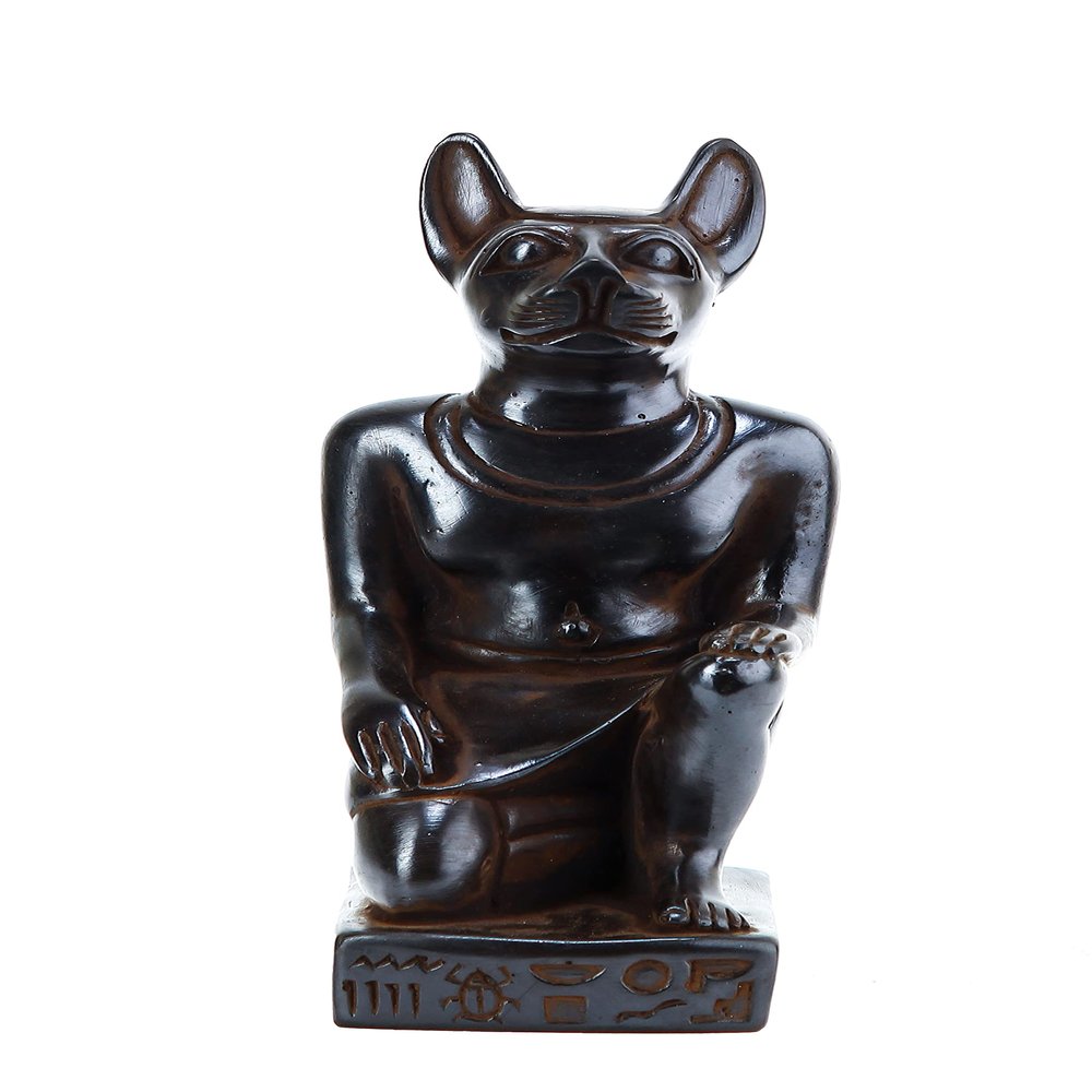Ancient Egyptian statue of goddess Bastet cat seated black solid stone made in Egypt. her late form a cat-headed woman, rather than a lioness Bastet was goddess of protection,cats, fertility