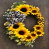 Oval Faux Sunflower Wreath with Plaid Bow on Grapevine Base 34 inches Tall with Large and Small Sunflowers, Yellow view 1