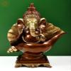 Exotic India 15" Ganesha Seated on Conch Pedestal - Brass - Color Brown with Natural Brass view 1