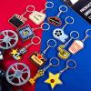 Taiyin 12 Pieces Movie Night Party Supplies Acrylic Movie Keychains Now Showing Party Supplies Camera Clapboard Microphone Ticket Film Keychain Souvenirs Gift Christmas Gifts view 4