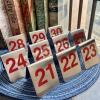 10 Pcs Metal Place Cards Stackable Tent Style Table NumbersPlace Card Holders for Celebration Wedding Party Restaurants Cafes Bars Gatherings meeting Room Board Game Serial (Medium 21-30, Red) view 3