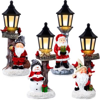 Christmas Table Centerpieces, 4 Pcs 10 Inch Santa Snowman Centerpieces with Light up Streetlights, Santa Glowing Lamppost LED Battery Operated Lighted Christmas Village Display for Home Table Ornament
