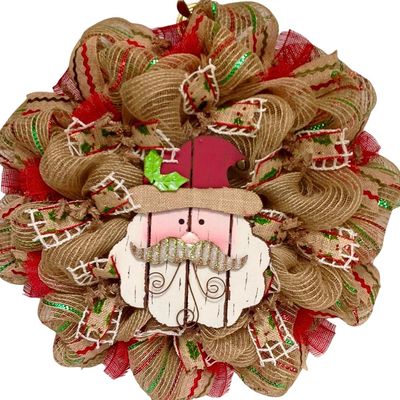 Adorable Wood Santa with Metal Whiskers Deco Mesh Christmas Wreath. Available in 24 inch and 28 inch diameters.