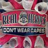 Fire Fighter Real Heroes Don't Wear Capes Deco Mesh Wreath. Available in 24 inch and 28 inch diameters. view 2