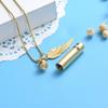 SHEIL Dog Cat Paw Print Cylinder Stainless Steel Cremation Necklace for Ashes with Angel Wing Charm Memorial Urn Jewelry view 2